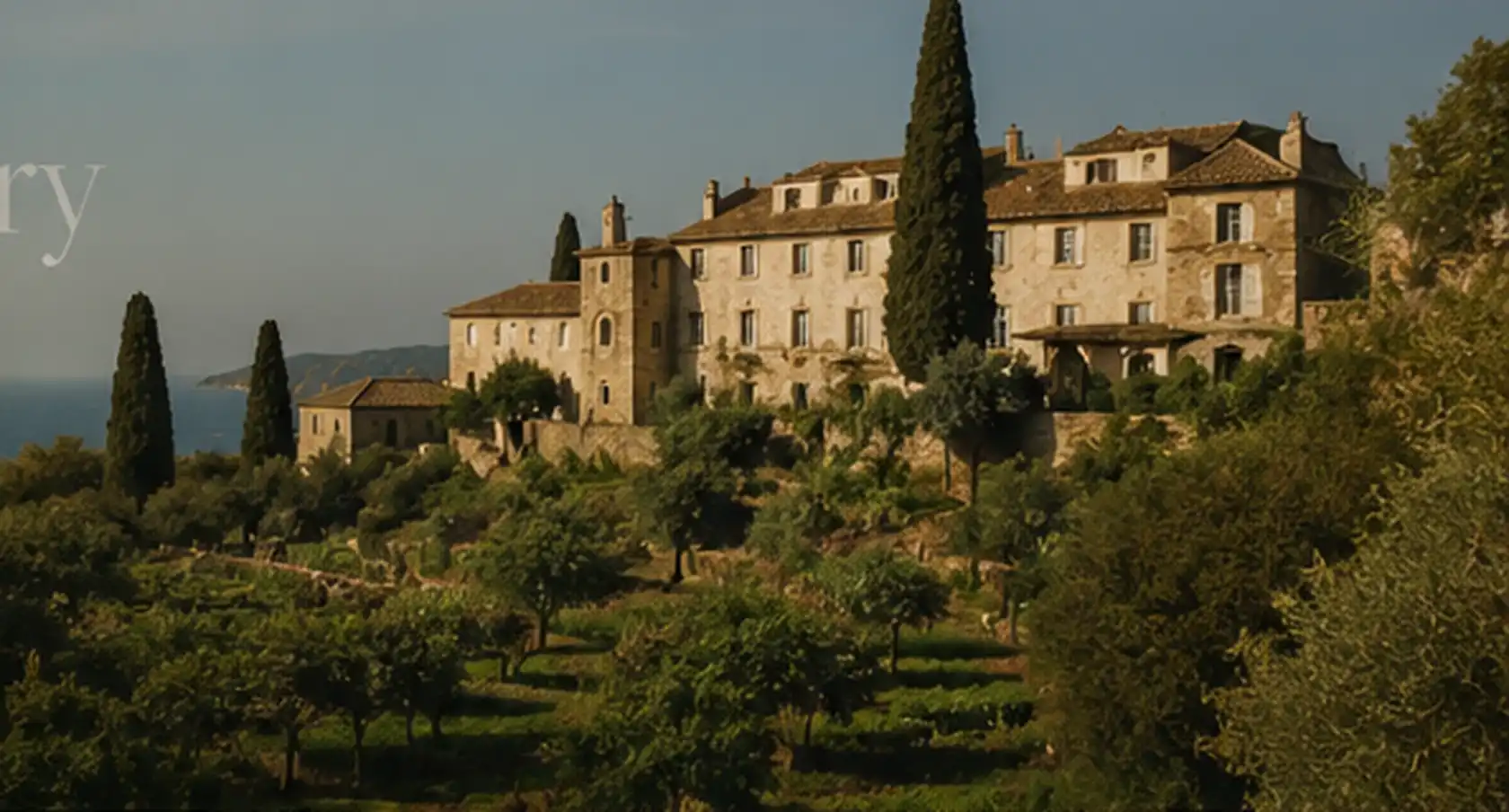 Old stone estate on a green Atlantic hillside above the sea